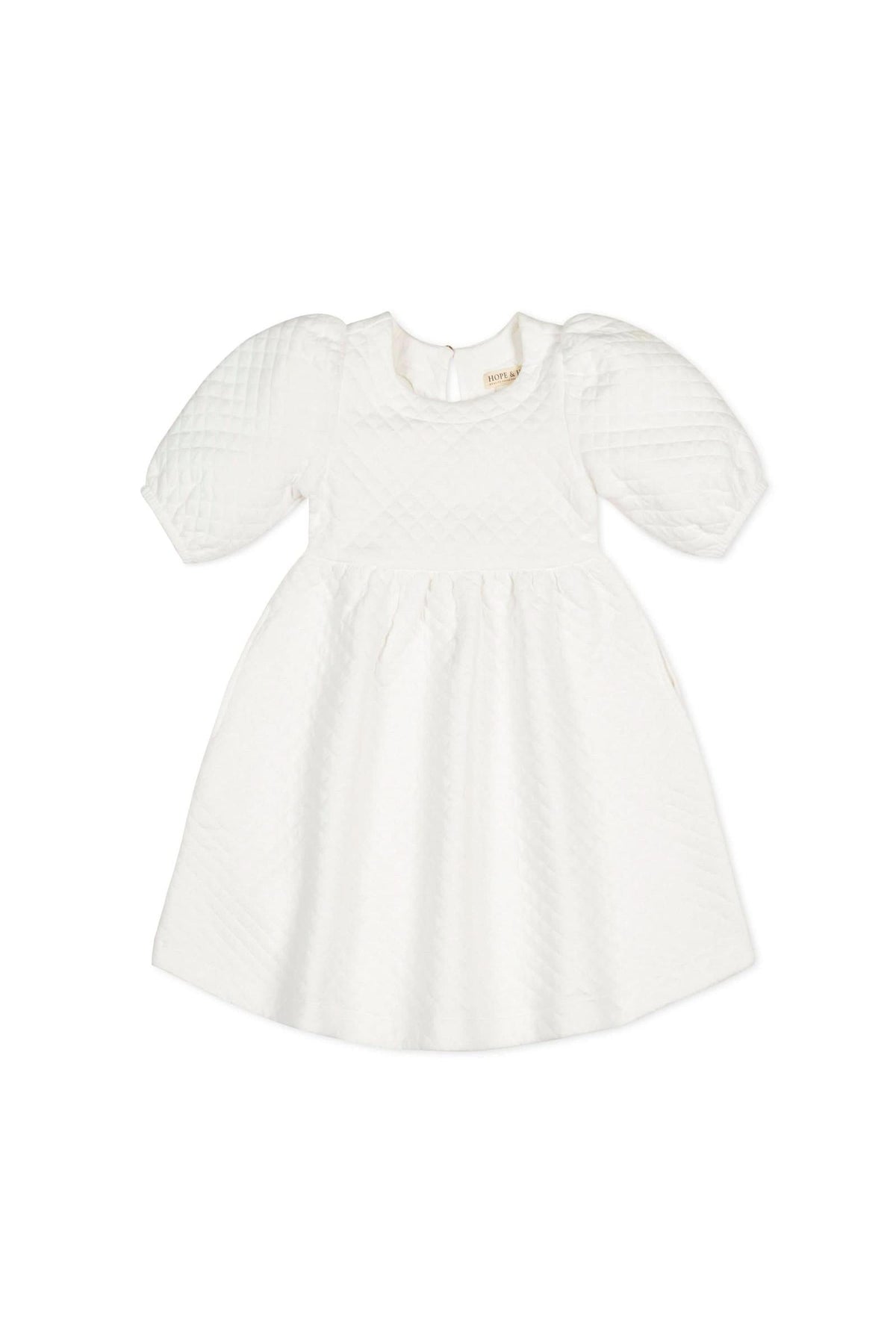 White quilted dress featuring puff sleeves and a twirly skirt, made from organic cotton. Suitable for toddlers and kids.