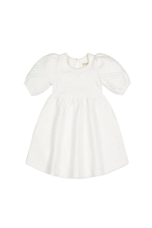 White quilted dress featuring puff sleeves and a twirly skirt, made from organic cotton. Suitable for toddlers and kids.