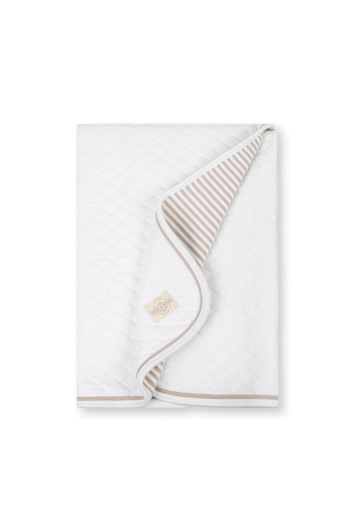 A soft, quilted baby blanket in white with a taupe striped lining. This organic cotton blanket is designed for newborns, providing comfort and warmth.