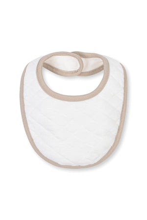 A quilted baby bib in white with taupe trim, designed for comfort and practicality. Made from organic cotton, it is ideal for newborns and ensures easy cleaning during mealtime.