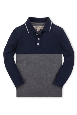 A long-sleeve colorblock polo for boys, featuring navy and gray organic cotton fabric. It includes a pointed collar with tipping and a front button placket for a classic look.