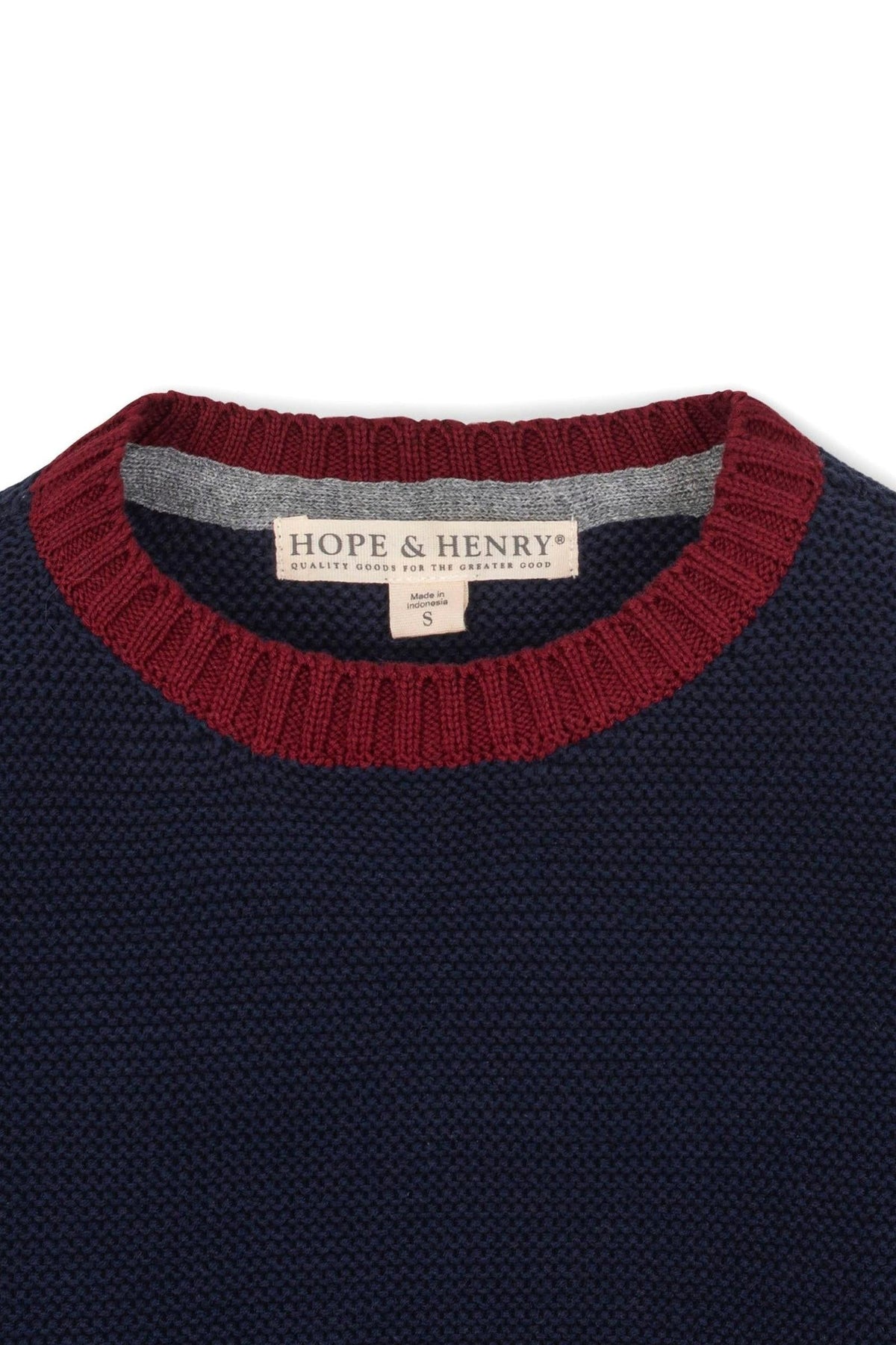 Close-up of a navy and gray crewneck sweater by Hope & Henry, featuring a textured knit and a maroon ribbed.