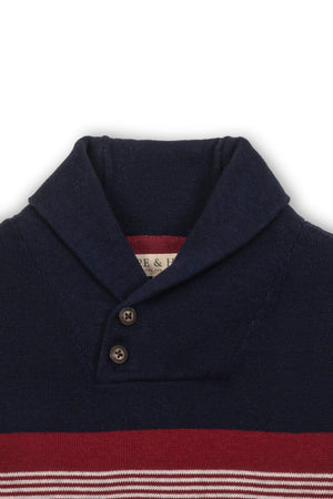 Close-up of a navy shawl collar sweater featuring a button closure and red stripe, made from soft organic cotton.