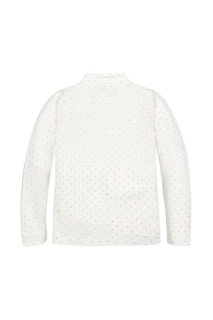 Back view of a soft white organic cotton mock neck knit top for girls, featuring a dotted pattern and long sleeves, perfect for layering in cooler weather.