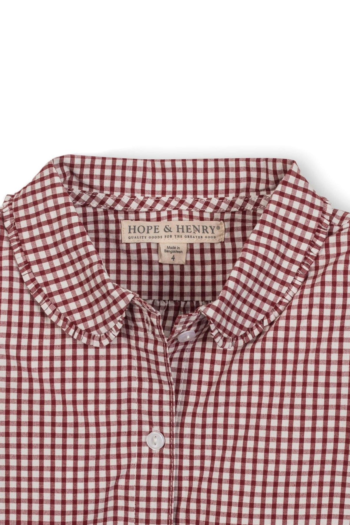 Close-up of a Hope & Henry organic cotton shirt featuring a red and white gingham pattern, with a Peter Pan.