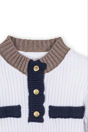 Close-up view of a white sweater featuring a mock neck and Henley button placket, accented with navy and brown ribbed details. Made from soft, GOTS-certified organic cotton for kids.