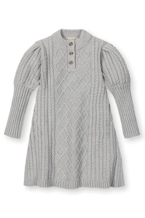 A soft grey sweater dress features a mock neck, button placket, and textured cable knit design, suitable for kids.