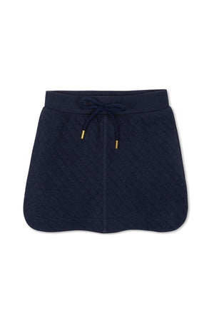 Navy quilted pull-on skort with an elastic waistband and faux drawcord, designed for comfort and active play in kids.