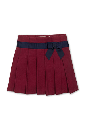 Dark red pleated skirt featuring a navy bow at the waist, made from soft organic cotton for toddlers and kids.