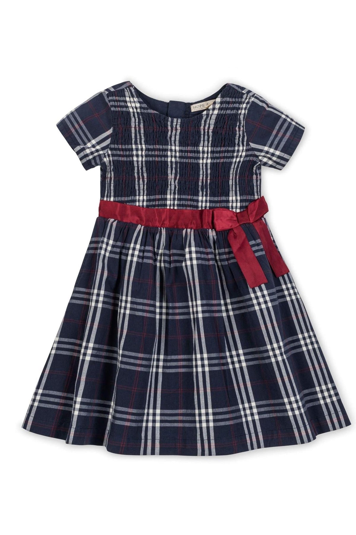 Navy plaid dress with short sleeves, smocked bodice, and a red ribbon belt, made from organic cotton. Ideal for girls.