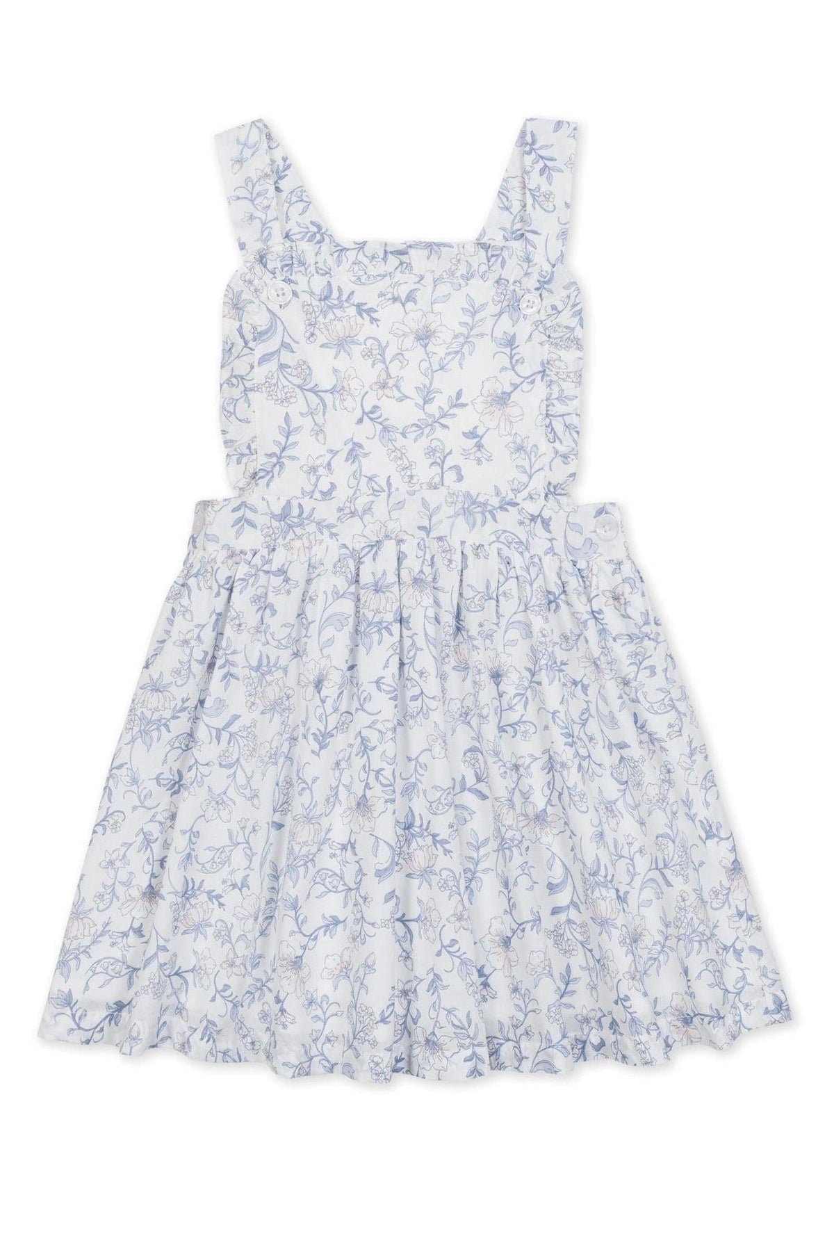 A charming white apron dress features a delicate blue floral pattern, ruffle straps, and a flared skirt. Made from organic cotton, this dress is perfect for girls and toddlers.