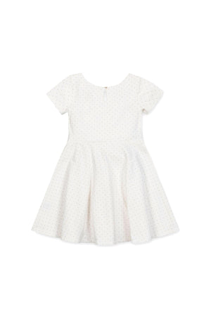 White skater dress with short sleeves, featuring a subtle pindot pattern, made of organic cotton for toddlers and kids.