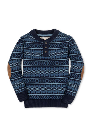 Navy blue sweater featuring a Fair Isle pattern, faux suede elbow patches, and a henley neckline with button closure.