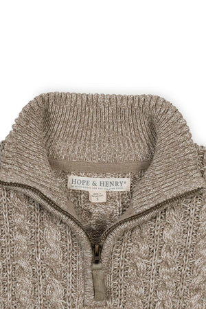 Close-up of a taupe marl cable knit half zip sweater by Hope & Henry, featuring a rib knit mock neck.