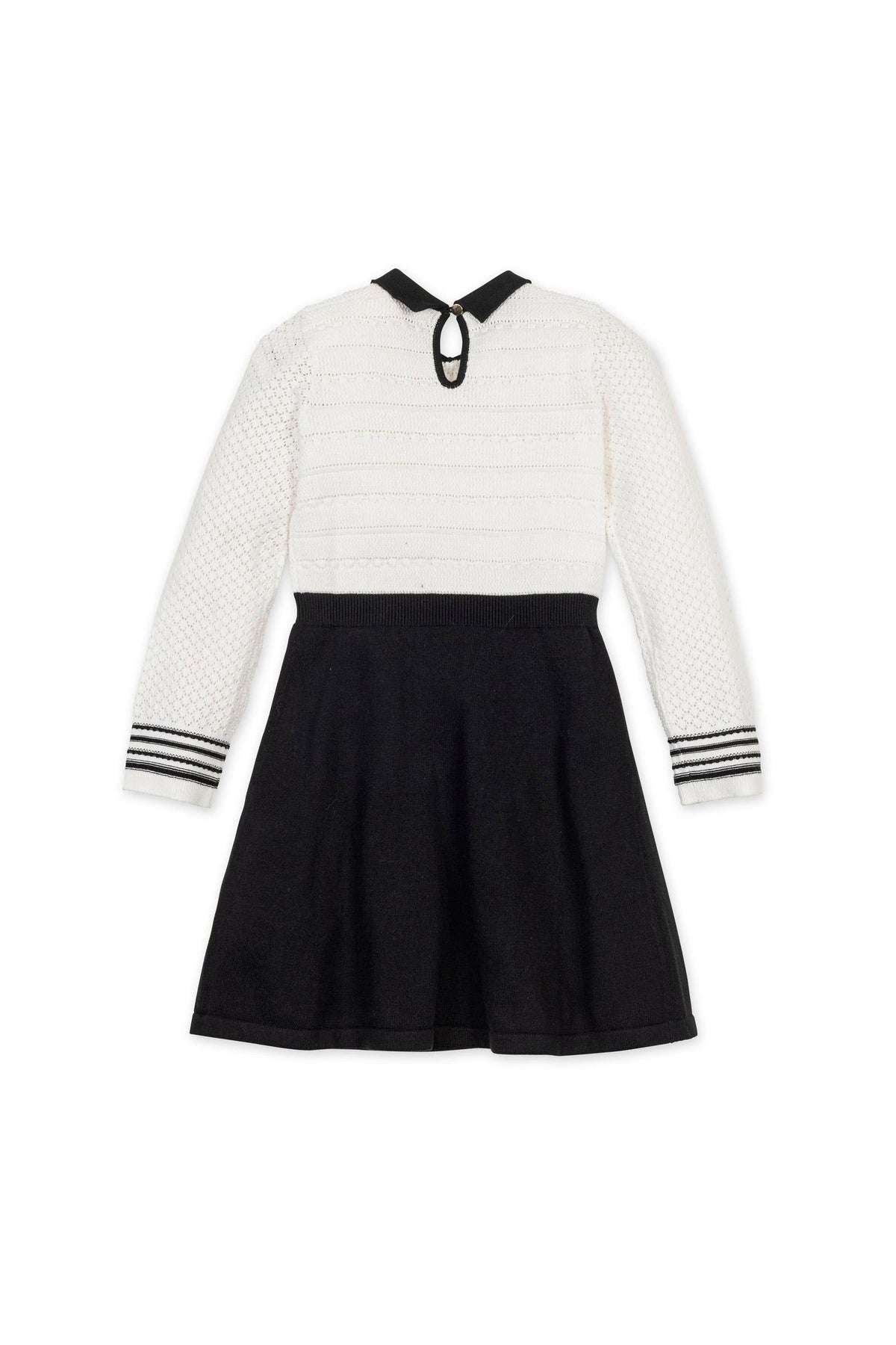 A back view of a Hope & Henry sweater dress showcasing a white textured bodice, black skirt, and striped sleeve details.