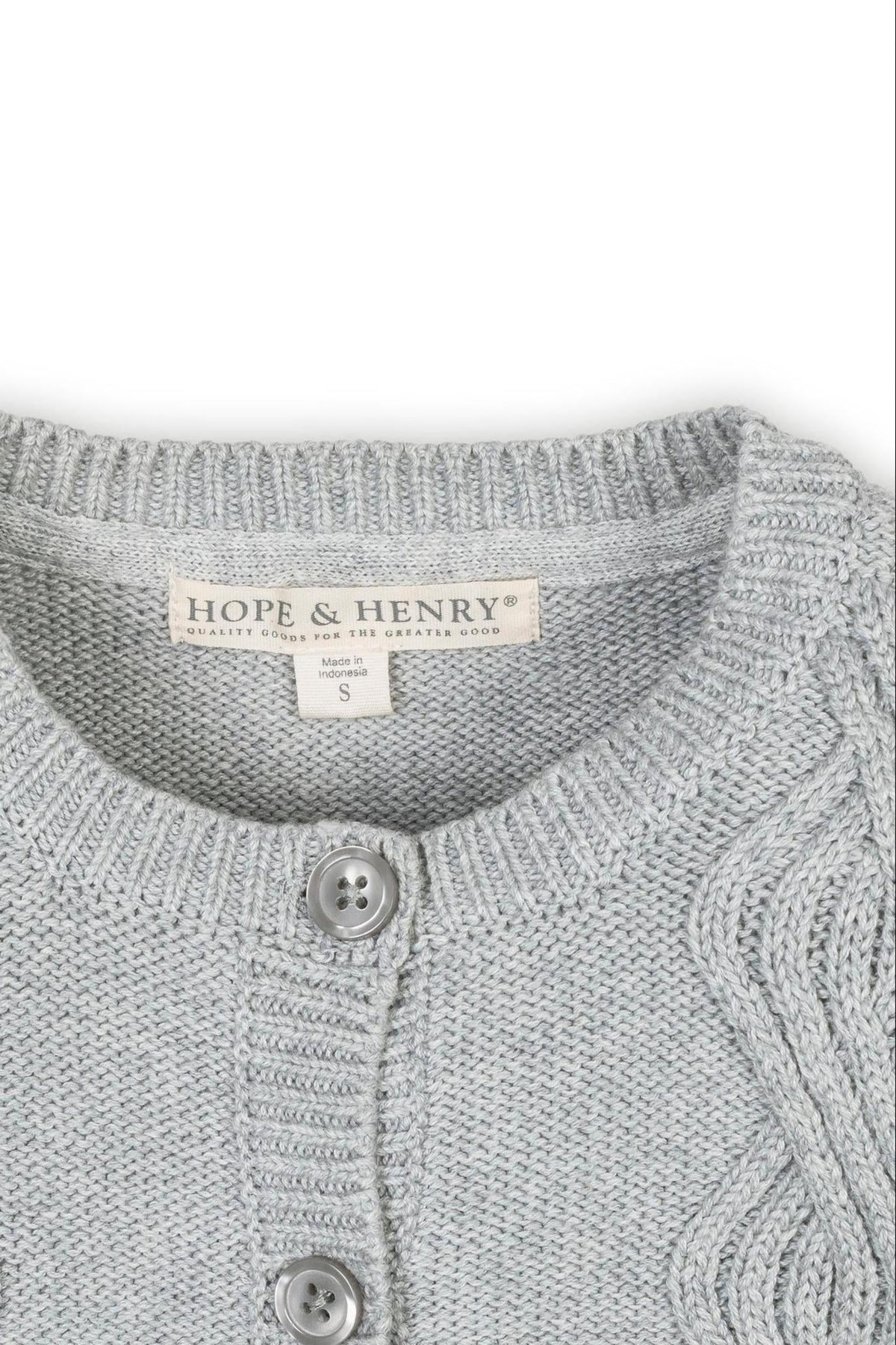 Close-up of a light gray Hope & Henry cardigan featuring a cable knit design and button closure, made of organic.