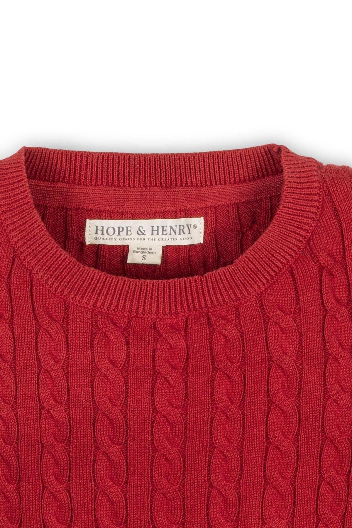 Close-up of a red cable knit sweater by Hope & Henry, featuring a round neckline and tag indicating size S.