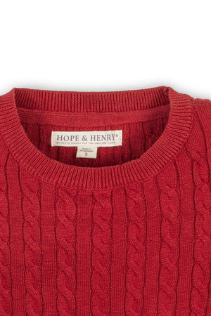 Close-up of a red cable knit sweater by Hope & Henry, featuring a round neckline and tag indicating size S.