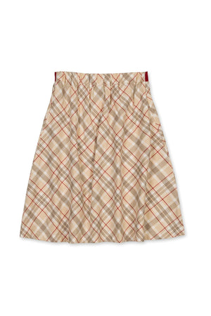A plaid skirt in beige, red, and brown tones, featuring a gathered waistband and a twirly silhouette.