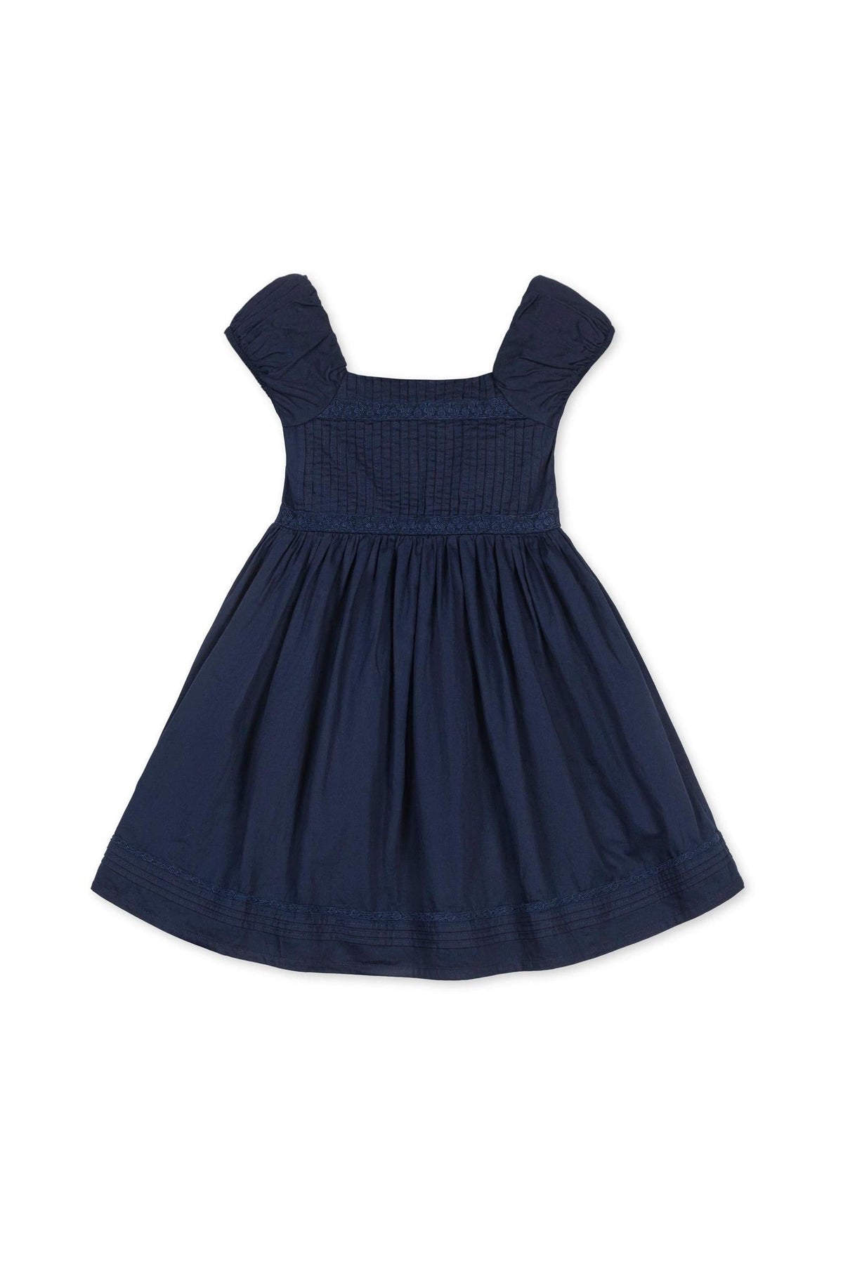 Navy organic cotton dress with puff sleeves and pintuck detailing, featuring a flared skirt and embroidered hem.