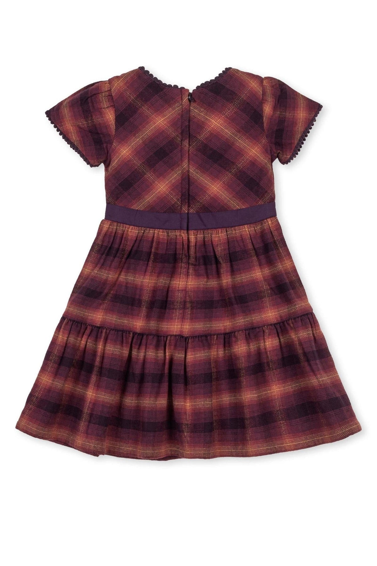 Back view of a tiered flannel dress in sugar plum plaid, featuring puff sleeves and a coordinating waistband.