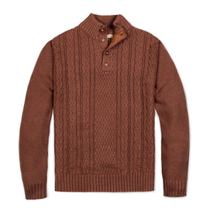 A cozy cinnamon heather mock neck cable sweater made from soft organic cotton, featuring a textured allover cable design and a faux suede button placket for added style.
