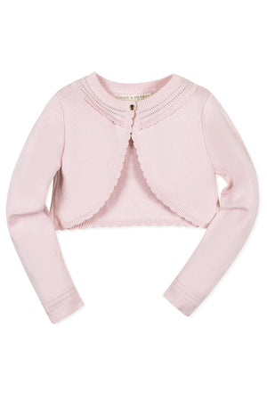 Light pink cropped cardigan from Hope & Henry, made of organic cotton, featuring a scalloped edge and pearlized button.