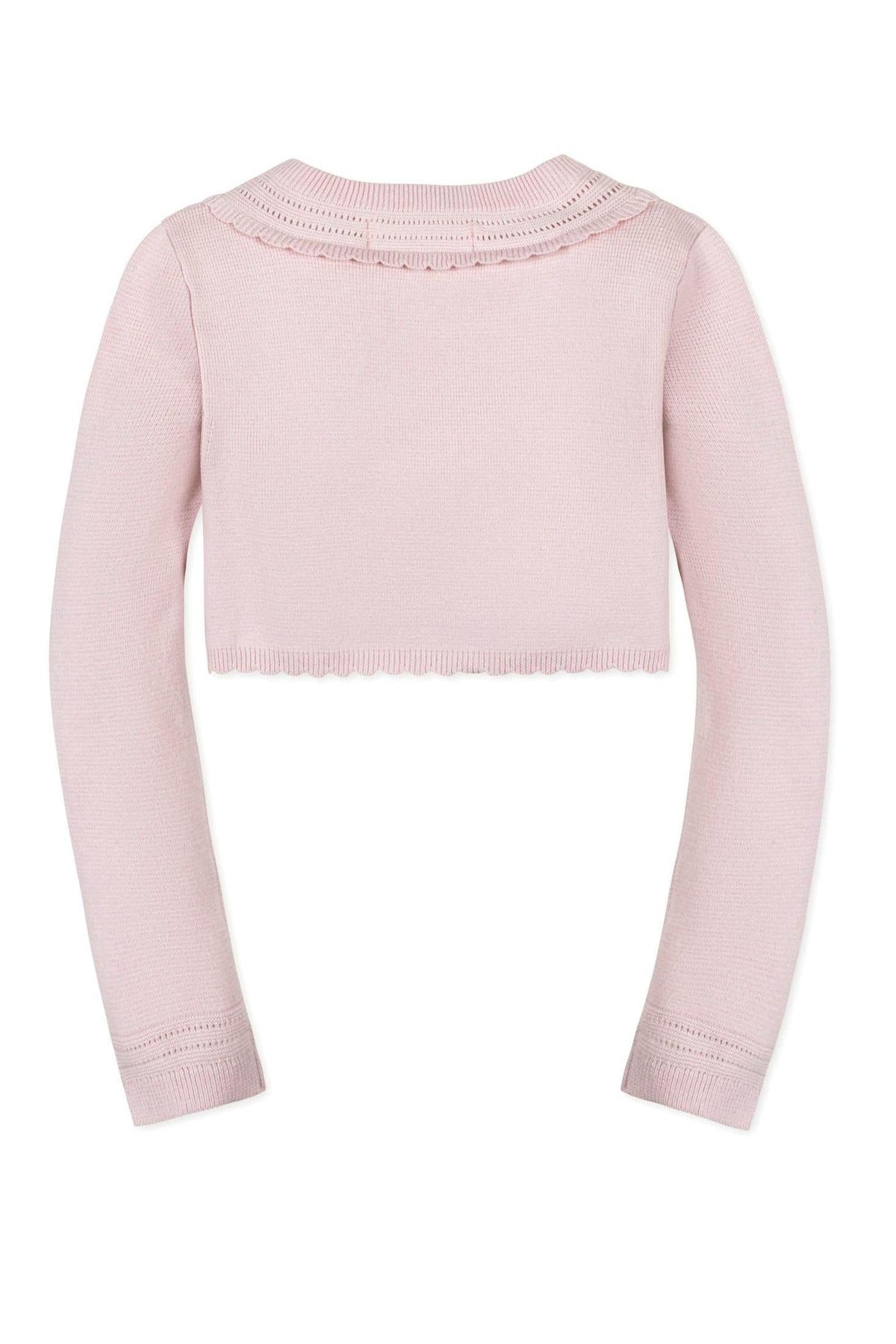Back view of a pink cropped cardigan with long sleeves, featuring a scalloped hem and delicate pointelle detailing.