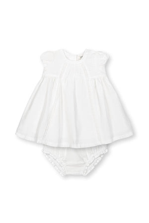 A white linen pintuck dress for babies with puff cap sleeves and a matching diaper cover, perfect for special occasions.