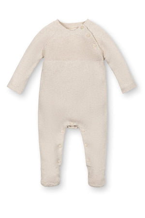 Light oatmeal footed romper made from soft organic cotton, featuring raglan sleeves and button closures for easy dressing.