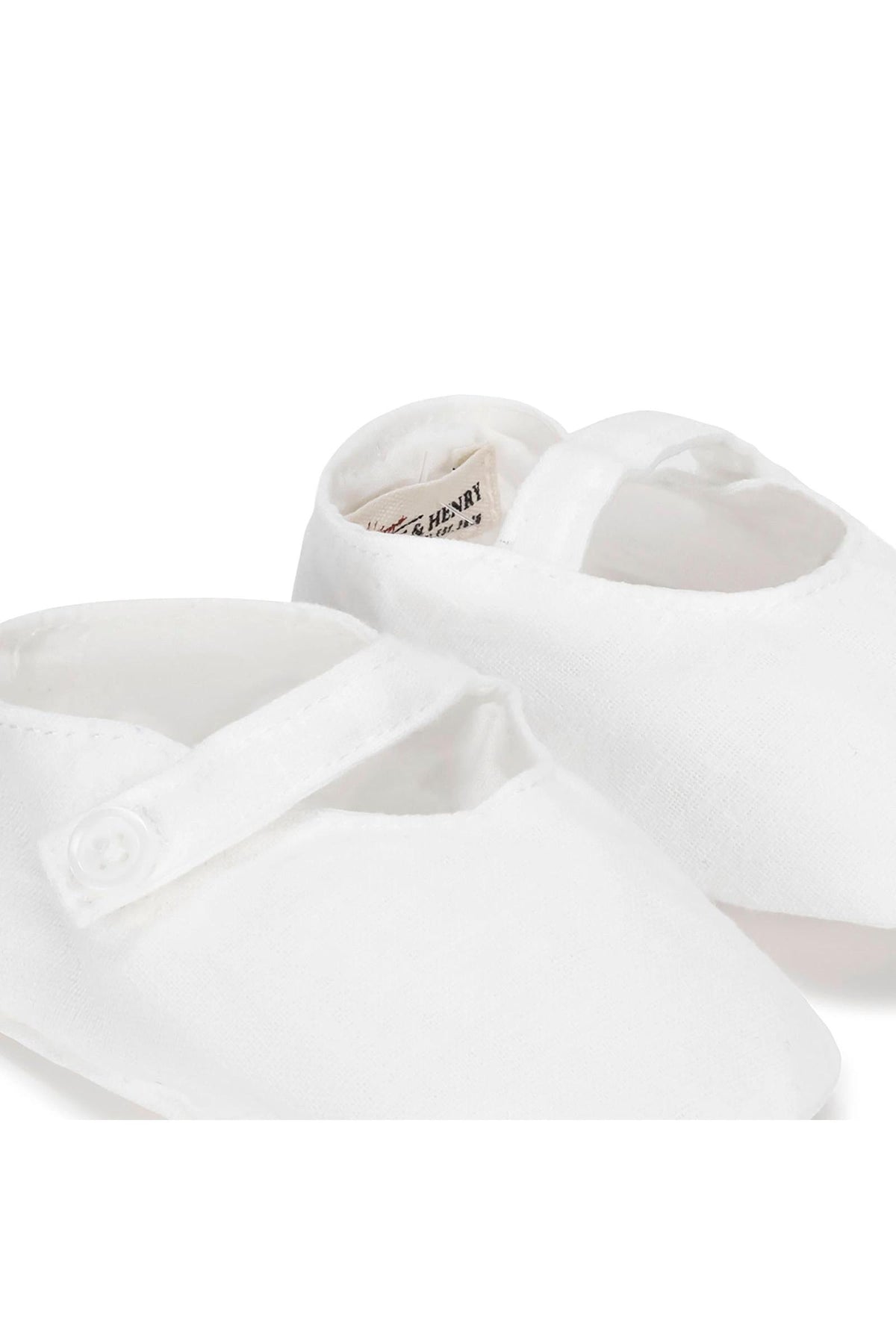 White linen baby shoes from Hope & Henry feature a button strap closure and soft construction, perfect for infants aged.