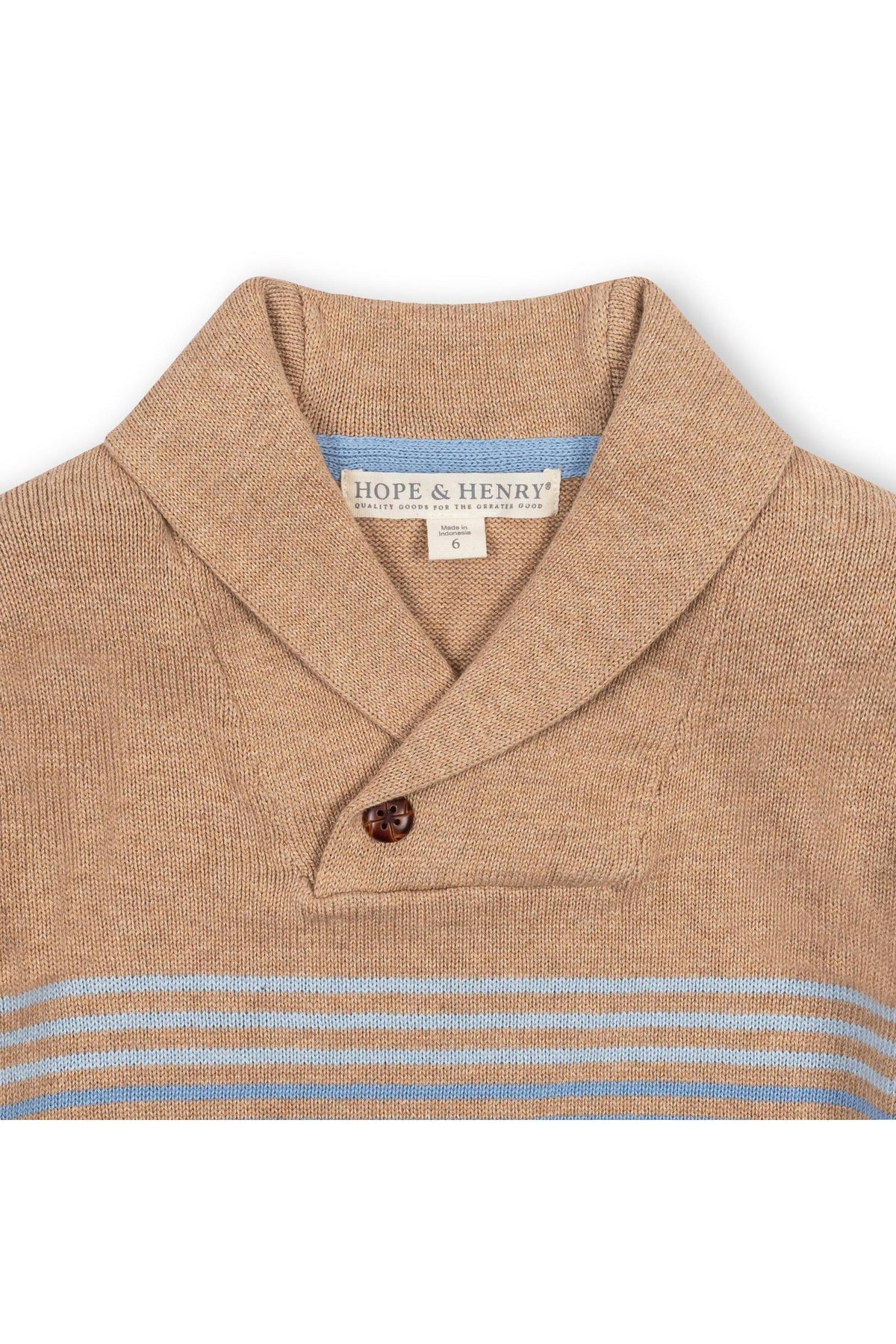 Close-up view of a camel-colored shawl collar sweater by Hope & Henry, featuring a button closure and light blue stripe details.