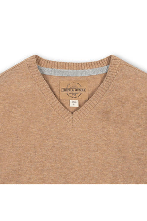 A close-up view of a camel-colored organic cotton V-neck sweater featuring a label from Hope & Henry. The soft fabric showcases a fine gauge knit, ideal for comfortable layering.