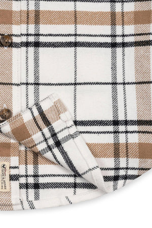 Close-up view of a soft white plaid flannel shirt featuring a classic design in tan and black, made from 100% organic cotton. Ideal for boys sizes 2T to 18/20.