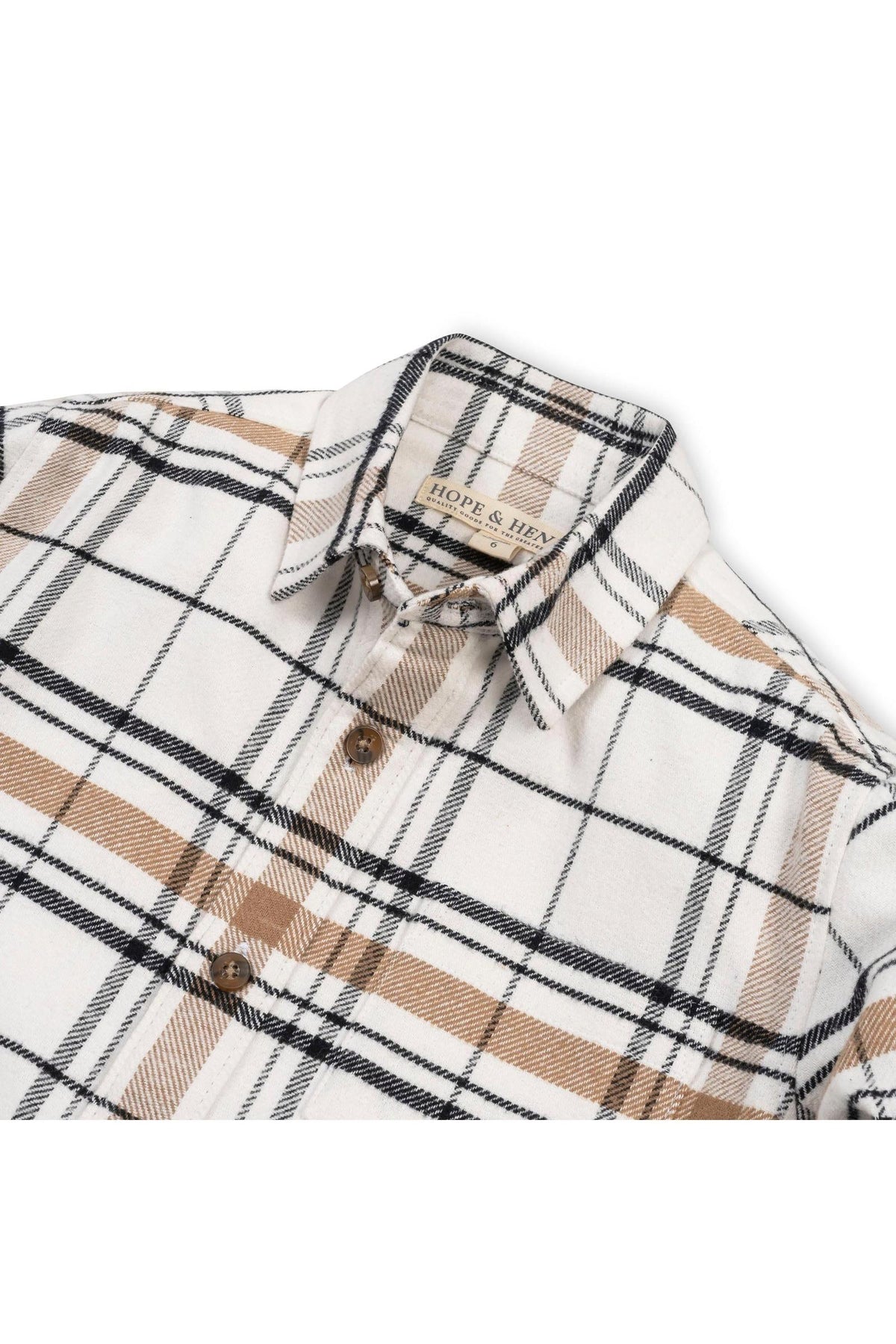 A soft white plaid shirt featuring brown and black stripes, made from organic cotton. The shirt is designed for boys and showcases a classic, timeless style suitable for various occasions.
