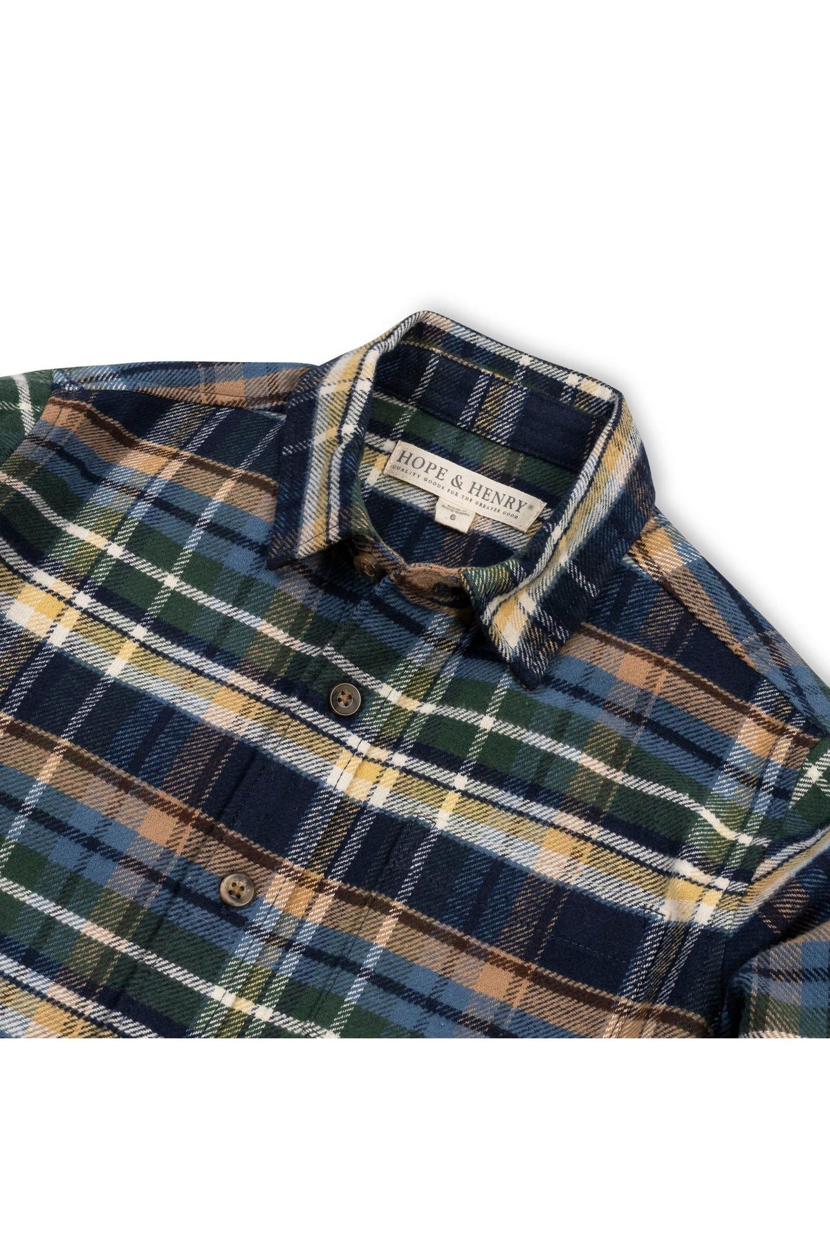 A close-up of a navy plaid flannel shirt by Hope & Henry, featuring earthy tones of green, yellow, and blue.