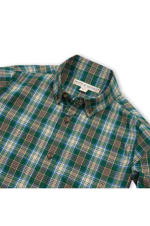 A green classic plaid shirt with a collared neckline and button closure, made from soft organic cotton. This stylish piece is perfect for boys aged 2T to 18/20.