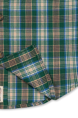 Close-up of a green plaid shirt featuring soft organic cotton material with hints of blue and orange. The shirt is designed for boys, showcasing a classic, timeless style.