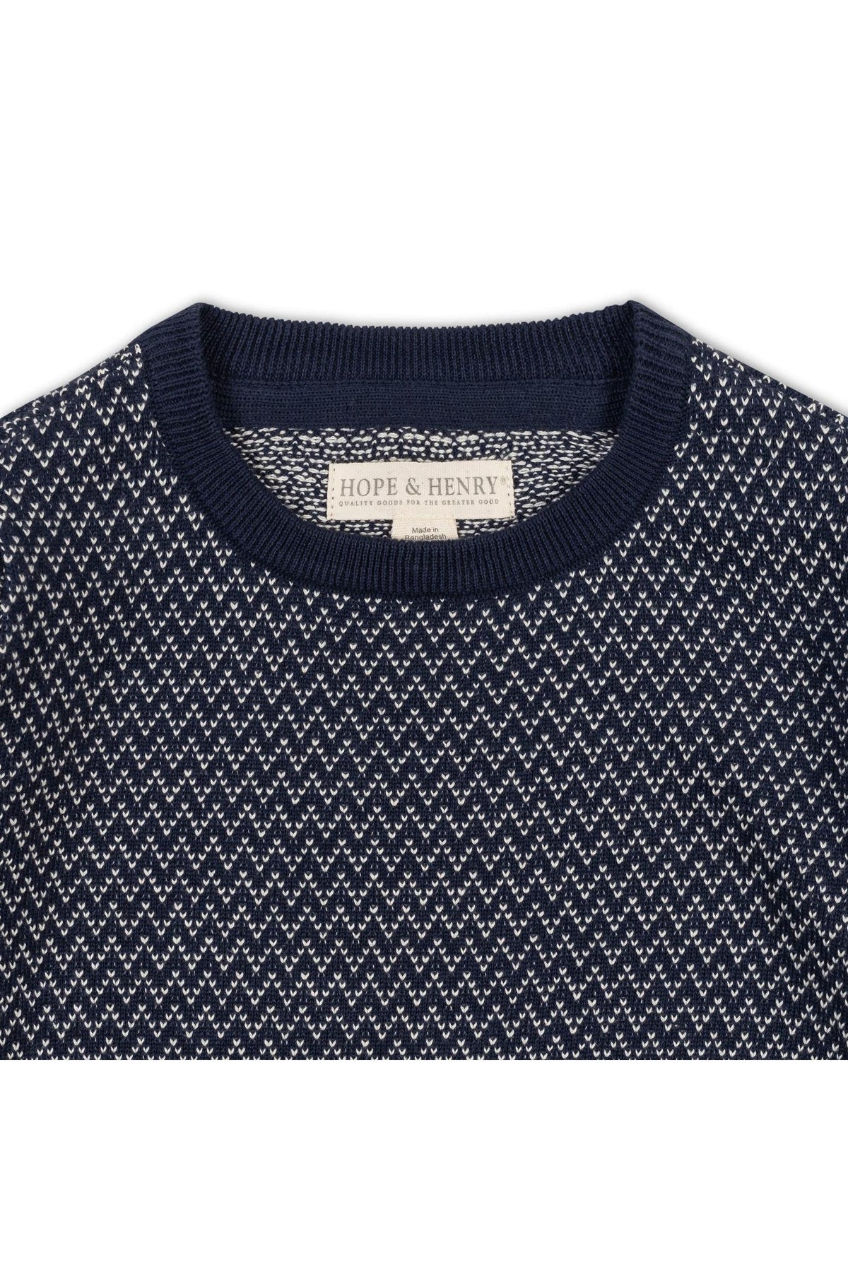 Close-up of a navy crew neck pullover sweater featuring a distinctive herringbone birdseye knit pattern. The label reads Hope & Henry, highlighting its organic cotton material.