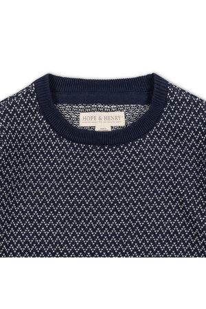 Close-up of a navy crew neck pullover sweater featuring a distinctive herringbone birdseye knit pattern. The label reads Hope & Henry, highlighting its organic cotton material.