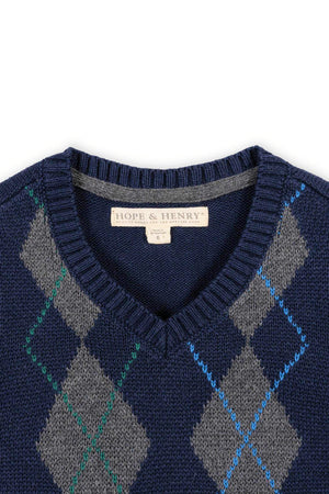 Navy and gray argyle sweater vest from Hope & Henry, featuring a V-neck design. Made from soft organic cotton, its ideal for boys sizes 2T to 18/20.