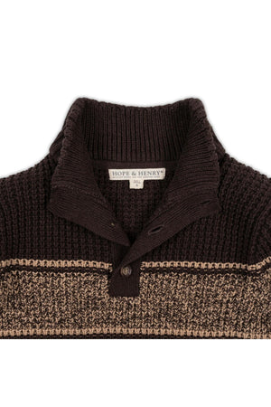 A close-up of a brown mock neck waffle sweater featuring a textured knit pattern and a contrasting camel stripe. The label reads HOPE & HENRY, emphasizing its quality and style.