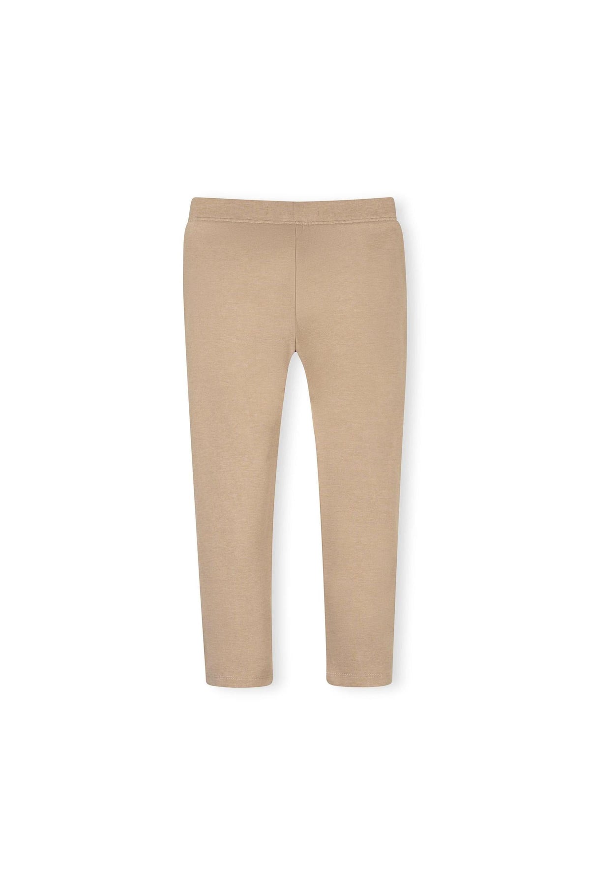 A pair of camel-colored ponte pants made from organic cotton, featuring a slim fit and button cuff detail. Ideal for toddlers and girls, these pants offer comfort and style.