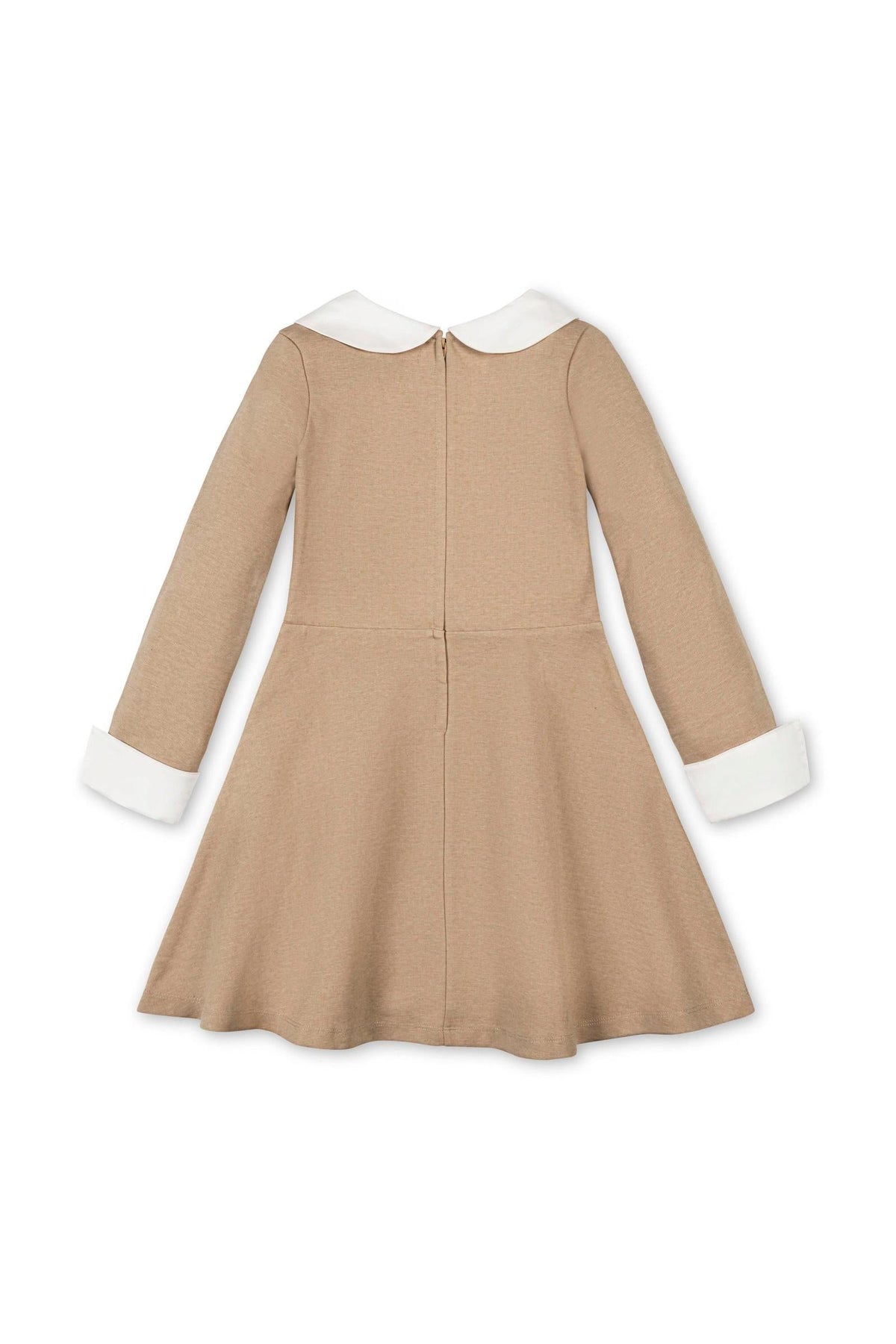 The image features a camel-colored dress for toddlers and girls, made from organic cotton. It showcases a classic silhouette with a Peter Pan collar and white cuffs.