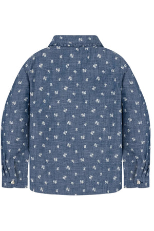 Back view of a blue chambray shirt featuring a floral pattern, long sleeves, and a classic collar.