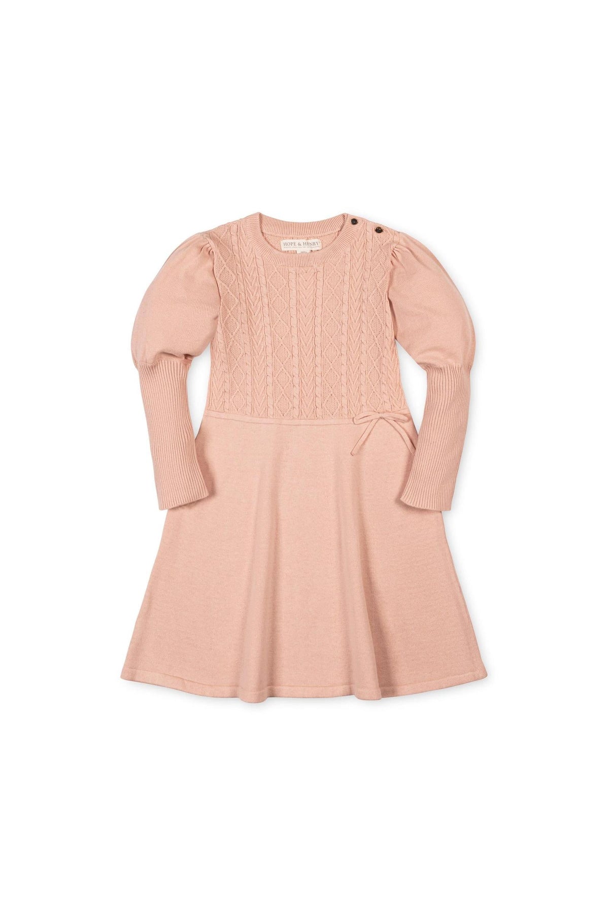 Soft blush sweater dress featuring a cable knit bodice and ribbed sleeves. Made from 100% organic cotton, this stylish dress is perfect for toddlers and girls at special occasions.