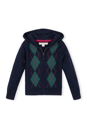 A navy zip-up hoodie features a classic argyle pattern in green and red. Made from 100% organic cotton, it’s perfect for toddlers and girls seeking comfort and style.