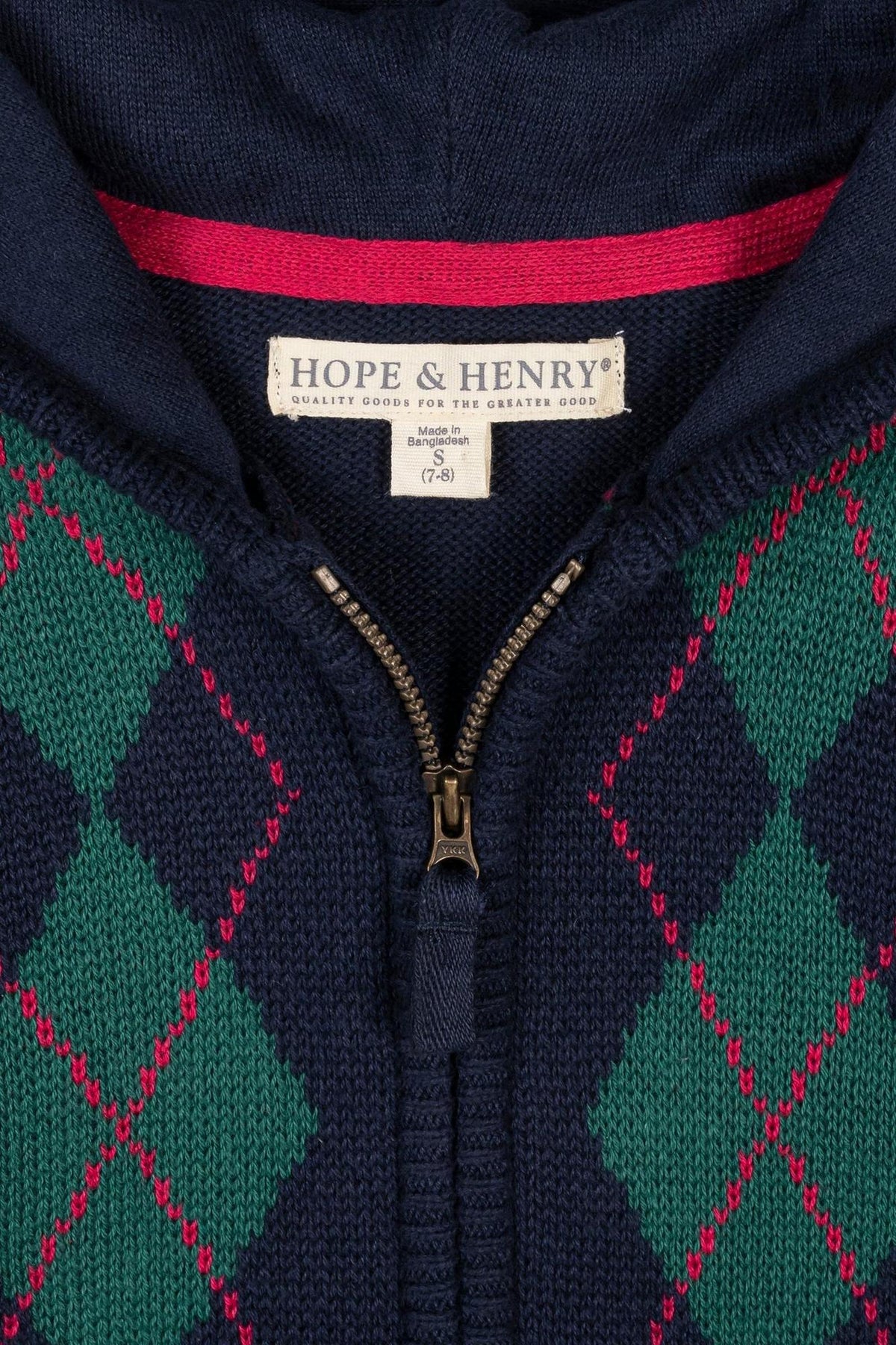 Navy organic full zip hoodie sweater by Hope & Henry features a classic argyle pattern in green and red. Crafted from 100% GOTS certified organic cotton for comfort and sustainability.