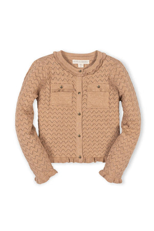 A soft beige pointelle cardigan featuring a ruffle trim and two front pockets, crafted from 100% organic cotton, perfect for toddlers and girls. Ideal for special occasions and everyday wear.
