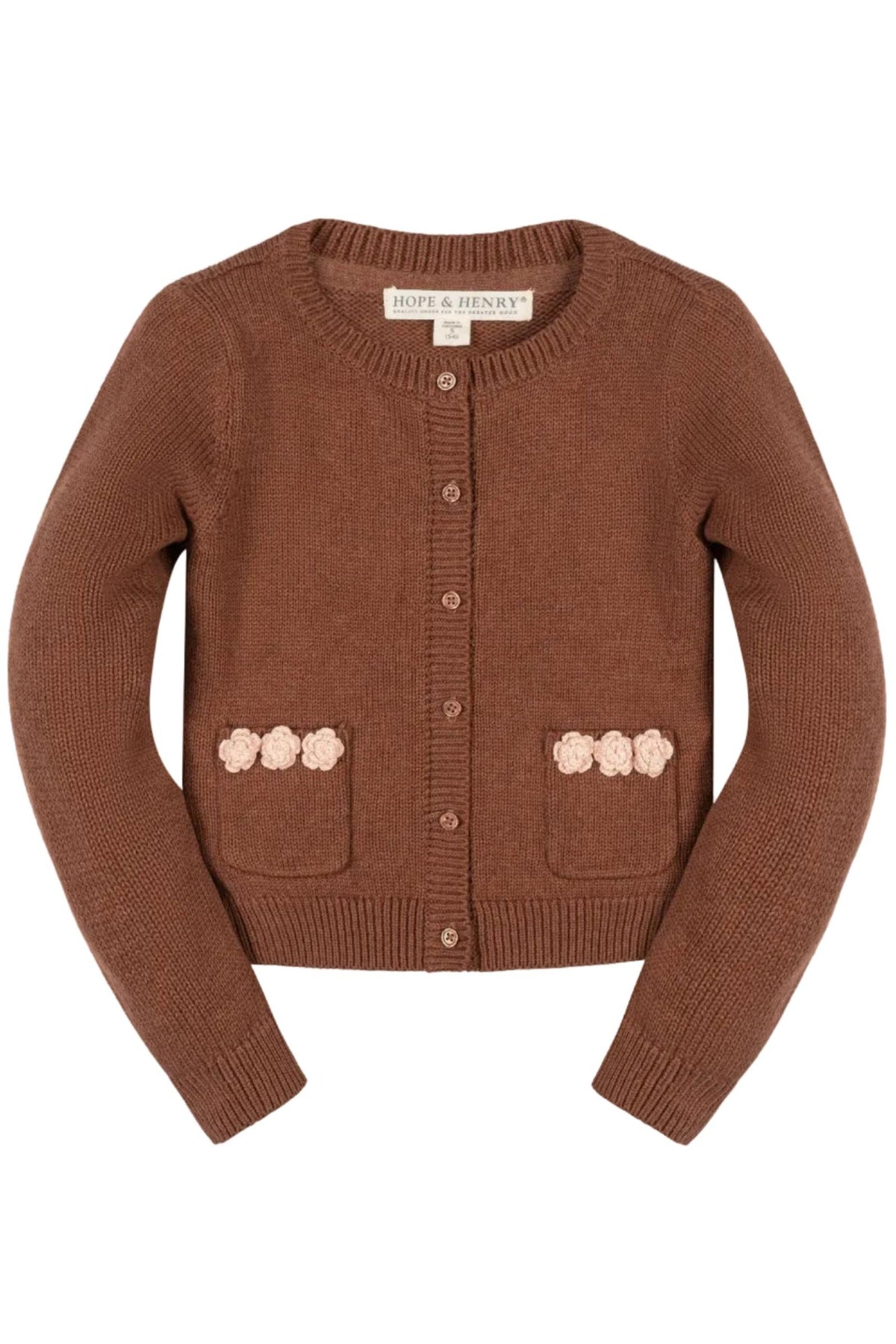 A cinnamon brown cardigan from Hope & Henry features a classic design with rosette pockets. Made from 100% organic cotton, its perfect for toddlers and girls seeking comfort and style.
